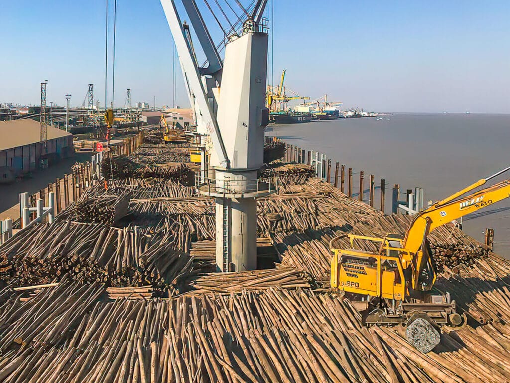 Moz Fibra pulpwood logs being loaded onto a ship for export at Beira Port Mozambique